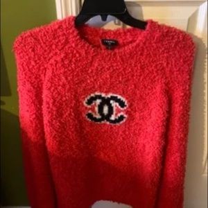 Trendy influencer red Chanel sweater